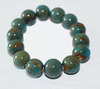 bracelet en perles de céramique et pierres kaki clair et turquoise monté sur élastique taille unique