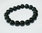 bracelet en perles de petites pierres noirs montés sur élastique taille unique