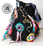Big bag in varnished calfskin leather and knitted wool crocheted in black and multicolored tones