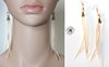 Designer earrings in pearls and nude pink goose feathers