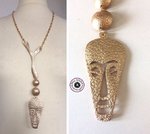 Long necklace in chain and luxury golden leather mask and half-sphere ethnochic style