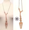 Long necklace in chain and luxury nude leather mask and half-sphere ethnochic style